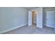 Bedroom featuring carpeted floors, closet space, and bright walls at 4712 Grandview Glen Dr, Auburndale, FL 33823