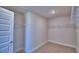 Walk-in closet featuring built in wire shelving and neutral color carpet at 4712 Grandview Glen Dr, Auburndale, FL 33823