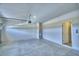 Spacious garage featuring a garage door and concrete flooring at 4712 Grandview Glen Dr, Auburndale, FL 33823