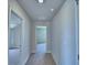 Hallway leading to bedrooms and other rooms in the home featuring neutral colors and carpet at 4712 Grandview Glen Dr, Auburndale, FL 33823