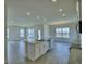 Modern kitchen island featuring granite countertops, stainless steel appliances, and open access to the living area at 4712 Grandview Glen Dr, Auburndale, FL 33823
