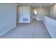 Upstairs carpeted loft area with bathroom access at 4712 Grandview Glen Dr, Auburndale, FL 33823