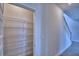 Walk-in pantry with wire shelving for storage, located near the staircase at 4712 Grandview Glen Dr, Auburndale, FL 33823