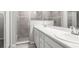 Bright bathroom featuring a double sink vanity, walk-in shower, and neutral color palette at 5335 Se 127Th Ln, Belleview, FL 34420