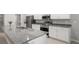 Modern kitchen featuring stainless appliances, granite countertops, and open layout at 5335 Se 127Th Ln, Belleview, FL 34420