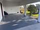 The covered patio provides a serene outdoor space perfect for dining or relaxing with views of the expansive backyard at 6155 Bethlehem Rd, Mulberry, FL 33860