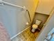 Bathroom featuring a modern toilet and accessibility railing at 6718 Trail Ridge Dr, Lakeland, FL 33813