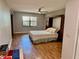 Comfortable bedroom with built-in shelves, a bed, and a ceiling fan at 6718 Trail Ridge Dr, Lakeland, FL 33813