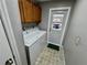 Functional laundry room with a washer, dryer, and plenty of cabinet space at 6718 Trail Ridge Dr, Lakeland, FL 33813