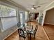 Cozy sun room with a glass table, sliding doors, and ample light at 6718 Trail Ridge Dr, Lakeland, FL 33813
