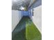 Narrow backyard space features a white fence and gate, offering privacy at 6799 Glenbrook Dr, Lakeland, FL 33811