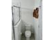 Clean bathroom with a glass-enclosed shower and a modern toilet at 6799 Glenbrook Dr, Lakeland, FL 33811