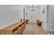 Inviting entryway featuring tiled floors, modern decor, and a stylish chandelier at 6799 Glenbrook Dr, Lakeland, FL 33811
