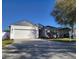 Attractive one-story home with a well-kept lawn and an attached two-car garage, ideal for comfort at 6799 Glenbrook Dr, Lakeland, FL 33811