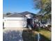 Charming single-story home with a well-manicured lawn and a two-car garage, perfect for a Gathering at 6799 Glenbrook Dr, Lakeland, FL 33811