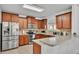 Charming kitchen features wooden cabinets and stainless steel appliances at 6799 Glenbrook Dr, Lakeland, FL 33811