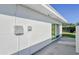 White house exterior with green shutters, landscaping, and walkway at 718 Barber Cir # 718, Lakeland, FL 33803