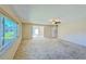 Spacious living room with large windows and neutral carpeting at 718 Barber Cir # 718, Lakeland, FL 33803