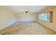 Bright living room with large windows and neutral carpeting at 718 Barber Cir # 718, Lakeland, FL 33803