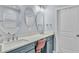 Spa-like bathroom with dual vanities, oval mirrors, and a soaking tub at 2325 Bella Luna Cir, Lakeland, FL 33810