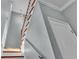 Elegant staircase with hardwood treads and metal railing at 2325 Bella Luna Cir, Lakeland, FL 33810
