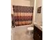 Bathroom with a granite countertop, a bathtub with shower, and neutral-colored walls at 3136 Country Club Cir, Winter Haven, FL 33881