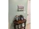 Coffee station featuring a Keurig, tiered pod holder, and 'Coffee First' decor at 3136 Country Club Cir, Winter Haven, FL 33881