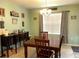 Bright dining room with wood table and chairs, hardwood floors at 3136 Country Club Cir, Winter Haven, FL 33881