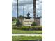 Country Walk community entrance sign framed by lush landscaping and stone accents at 3136 Country Club Cir, Winter Haven, FL 33881