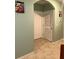 Hallway features white doors and light green walls at 3136 Country Club Cir, Winter Haven, FL 33881