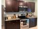 Modern kitchen with stainless steel appliances and granite countertops at 3136 Country Club Cir, Winter Haven, FL 33881