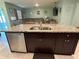 Spacious kitchen island with granite countertop and double sink at 3136 Country Club Cir, Winter Haven, FL 33881