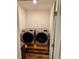 Laundry room with washer and dryer on a pallet, with a 'Laundry Room' rug on the floor at 3136 Country Club Cir, Winter Haven, FL 33881