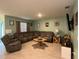 Inviting living room featuring a comfortable sectional sofa and neutral color palette at 3136 Country Club Cir, Winter Haven, FL 33881
