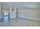 Expansive open floor plan with tile flooring, neutral walls, and ample space for furniture arrangement at 4050 Tullamore Ln, Auburndale, FL 33823
