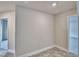 Neutral tone room showing tiled floor and doorways with fresh white trim at 4050 Tullamore Ln, Auburndale, FL 33823