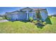 Charming single-story home with landscaped front yard, gray siding and brick driveway at 4639 Grandview Glen Dr, Auburndale, FL 33823