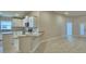 Open-concept kitchen featuring white cabinets, granite countertops and island with bar seating at 4639 Grandview Glen Dr, Auburndale, FL 33823