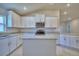 Well-lit kitchen with white cabinetry, granite countertops, and stainless steel appliances at 4639 Grandview Glen Dr, Auburndale, FL 33823