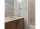 Bathroom features a wood vanity, shower, and a large mirror at 6123 Topher Trl # 63C, Mulberry, FL 33860