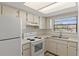 Efficient kitchen with white appliances at 6123 Topher Trl # 63C, Mulberry, FL 33860