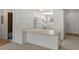 Kitchen with breakfast bar and view into living room at 6123 Topher Trl # 63C, Mulberry, FL 33860