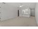 Living room with open layout and kitchen view at 6123 Topher Trl # 63C, Mulberry, FL 33860