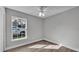 Bedroom with window, wood-look floors, and closet at 110 5Th Sw St, Fort Meade, FL 33841