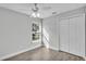 Bedroom with window, wood-look floors, and closet at 110 5Th Sw St, Fort Meade, FL 33841