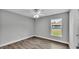 Bedroom with large window and wood-look floors at 110 5Th Sw St, Fort Meade, FL 33841