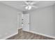 Bedroom with access to hallway and ceiling fan at 110 5Th Sw St, Fort Meade, FL 33841