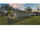 Rear view of a newly built home showcasing its clean lines and landscaping at 110 5Th Sw St, Fort Meade, FL 33841