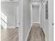 Light and bright hallway with wood-look floors at 110 5Th Sw St, Fort Meade, FL 33841