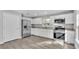 Modern kitchen with white cabinets, stainless steel appliances, and granite countertops at 110 5Th Sw St, Fort Meade, FL 33841